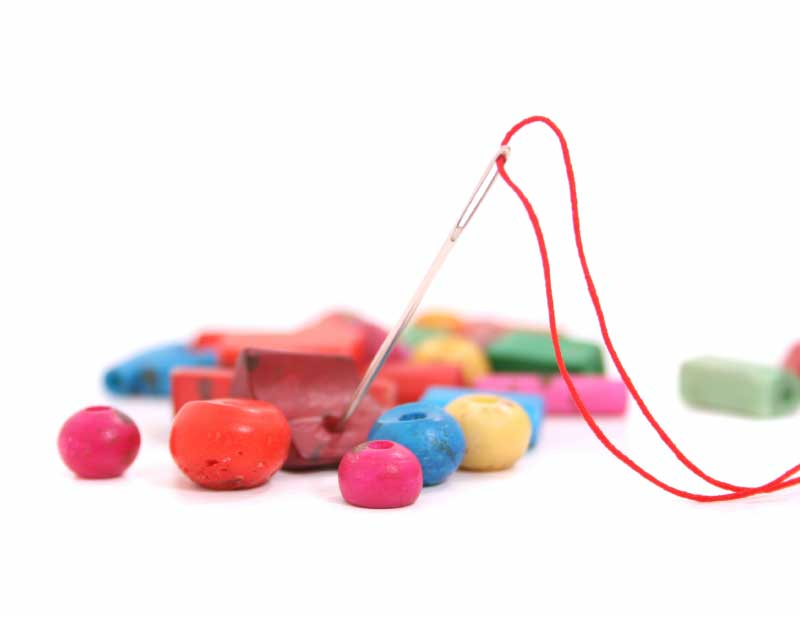 colorful beads with needle and thread