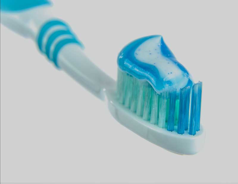 toothbrush with blue and green bristles